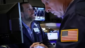 Traders work on the floor of the New York Stock Exchange