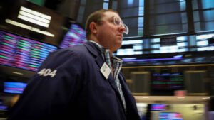 A Trader works on the floor of the New York Stock Exchange NYSE