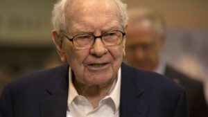 Berkshire cuts Apple investment by about 13%, Buffett hints that it's for tax reasons