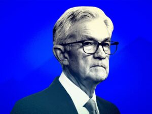 US indexes edge higher to records as Powell talks up strength of the economy